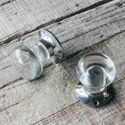 Set of Two Clear Glass and Chrome Flat Globe Door Knobs